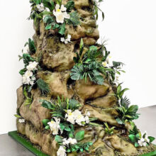 AARTI - ROCK - ALT. VIEW - Sculpted giant jungle themed rock with our handcrafted plants and florals